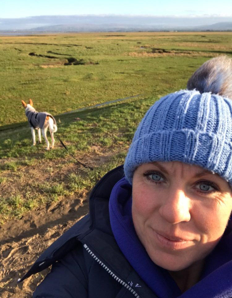 Nicole in the countryside with her dog